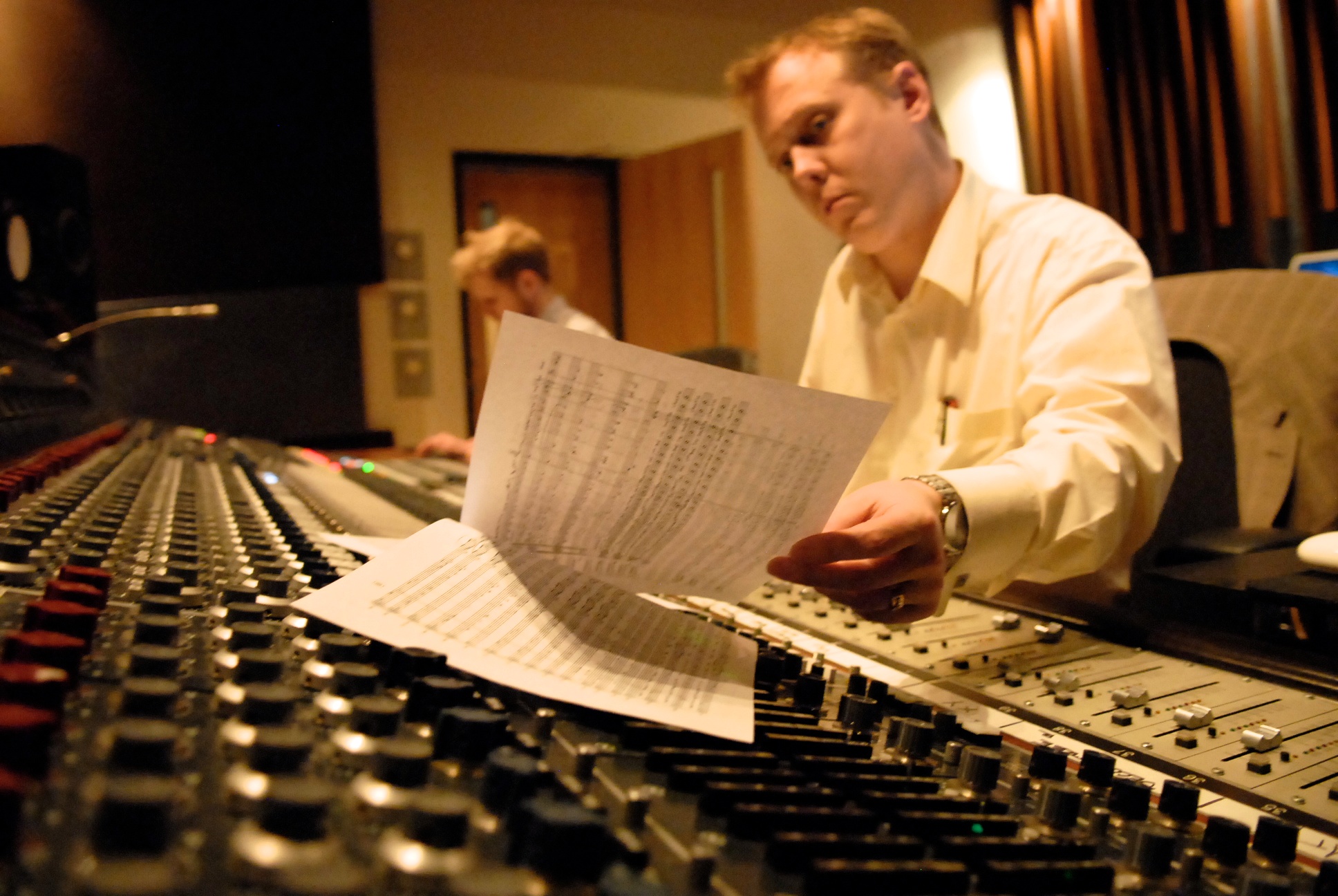Michael Nunan recording a music score on a Neve console at Revolution Recording